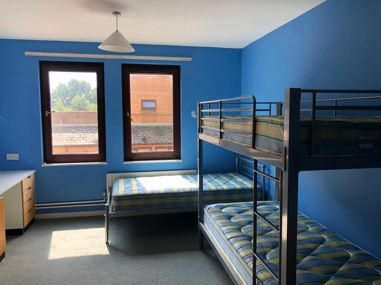 A residential bedroom with bunk beds